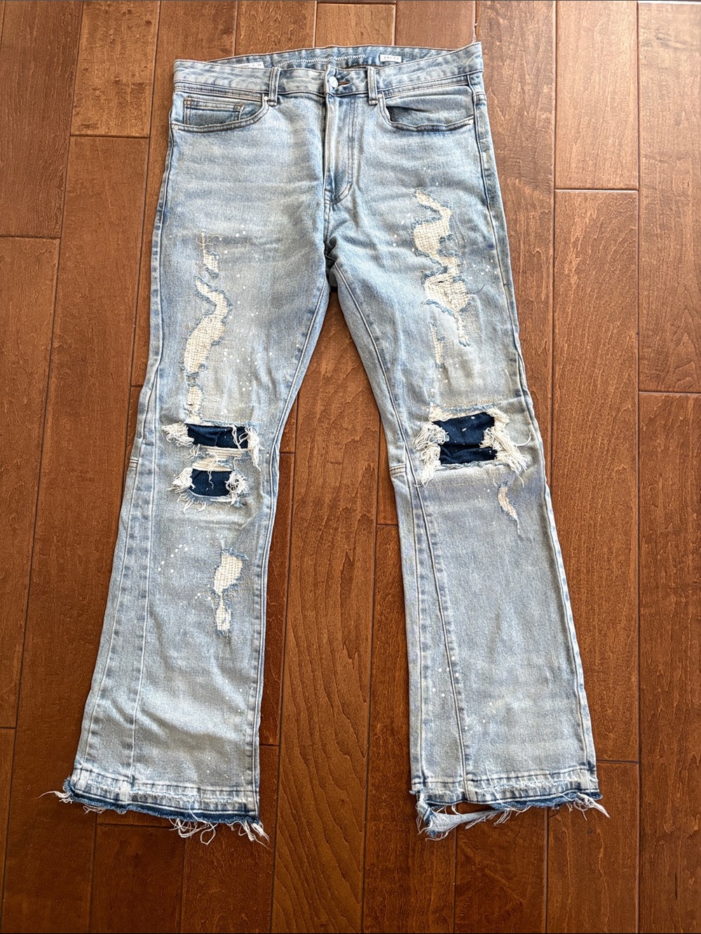 First Row Light Wash Distressed Ripped Jeans with Patch Detail